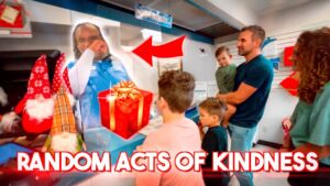 Family watches a man behind a store counter with a red gift graphic, as kids and a parent stand nearby, on a thumbnail reading 'RANDOM ACTS OF KINDNESS'.