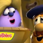 VeggieTales scene with a purple eggplant character talking to a yellow mustached man wearing a blue hat in a wooden cart.