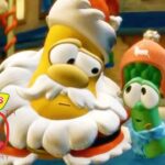 Two VeggieTales characters in a snowy town: a large yellow bearded figure beside a green cucumber in a pink hat, with a 30th anniversary logo nearby.