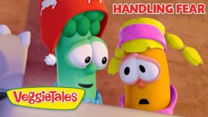 Cartoon broccoli and carrot characters from VeggieTales, looking worried with 'Handling Fear' title visible.