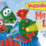 VeggieTales Christmas scene with a colorful train, characters in festive hats, and presents under a snowflake sky, title Merry Larry and the True Light of Christmas.