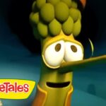 Animated VeggieTales character with a long corn-nose and wide eyes, against a blue backdrop. Seen with the VeggieTales logo in the corner.