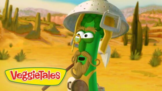 Cartoon green bean adventurer wearing a metal helmet and glasses in a desert, VeggieTales logo in the corner.