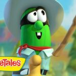 Cartoon cucumber character from VeggieTales wearing a white hat, red scarf, blue shirt, and holding a stick in a forest setting.