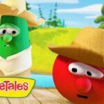 Two VeggieTales characters—a cucumber and a tomato—wear straw hats on a wooden dock by a sunny river, with surprised expressions.
