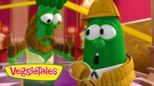 Two green VeggieTales characters in a colorful room; one wears a hat and scarf and holds a magnifying glass, VeggieTales logo visible in corner.