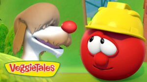 Animated tomato wearing a yellow hard hat chats with a doglike character; VeggieTales logo at the bottom left.