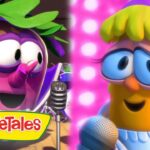 Two VeggieTales characters singing into microphones on a colorful stage, VeggieTales logo visible on the left.