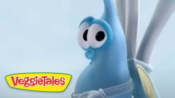 Blue VeggieTales character with big googly eyes against a pale sky, VeggieTales logo in the bottom-left corner.