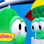 Two green VeggieTales characters with big eyes converse on a colorful set; VeggieTales logo appears in the bottom-left corner.