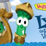 Lyle the Kindly Viking, a green cucumber wearing a Viking helmet, aboard a wooden ship with veggie friends; VeggieTales logo on the side.