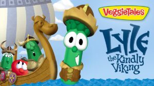 Lyle the Kindly Viking, a green cucumber wearing a Viking helmet, aboard a wooden ship with veggie friends; VeggieTales logo on the side.