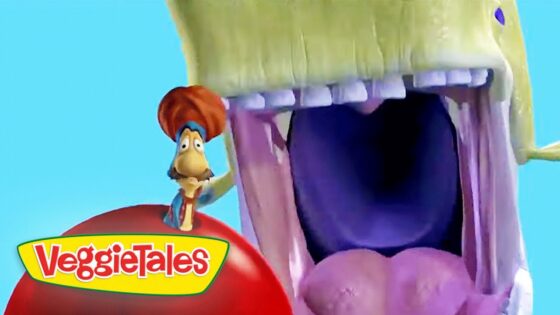 Close-up of a VeggieTales character with an oversized open mouth against a bright blue sky, VeggieTales logo in the lower left margin.