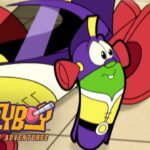 LarryBoy from The Cartoon Adventures lying on a tiled floor in a purple suit and cape, with a surprised expression and the show logo in the corner.