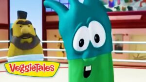 Animated VeggieTales scene: a teal cartoon vegetable with big eyes in a ring, foreground, with a yellow-bearded character in the background and the VeggieTales logo bottom left.