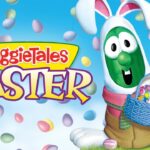 VeggieTales Easter: a green veggie in a white bunny suit holding a blue basket full of colorful Easter eggs.