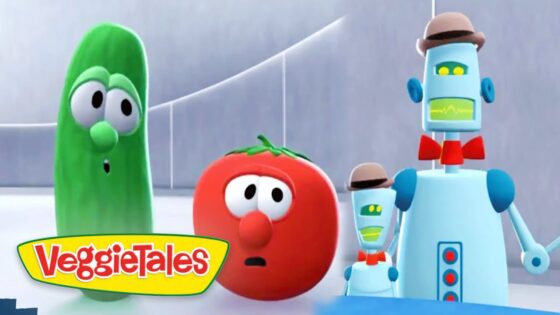 Green cucumber character and red tomato with surprised expressions, alongside two small blue robots wearing hats in a VeggieTales scene