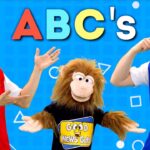 Three hosts and a puppet monkey pose on a bright blue background with the 'ABC's' title, for a cheerful kids' video thumbnail.