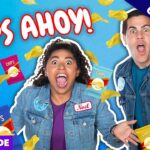 Video thumbnail: two people in denim jackets shouting with bags of chips and floating chips on a bright blue background; bold "CHIPS AHOY!" text and banners saying Exclusive and Full Episode.
