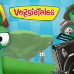 VeggieTales cover scene with a tall green vegetable and other veggie characters in a fast-paced car chase against a bright blue background.