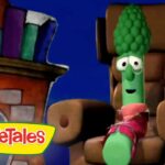 Animated green veggie with a broccoli-like head sits on a brown throne, wearing a pink scarf; VeggieTales logo visible in the corner.