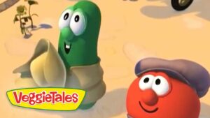 Two VeggieTales characters, a green bean and a red tomato with a hat, stand in a sandy desert; VeggieTales logo in the corner.