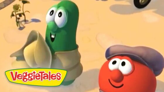 Two VeggieTales characters, a green bean and a red tomato with a hat, stand in a sandy desert; VeggieTales logo in the corner.