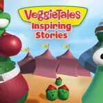 Cartoon VeggieTales cover with two characters in boxing poses, a green cucumber fighter on the left and a tall bean on the right wearing a striped hat; desert-style background with tents and small peas in the foreground; title reads 'VeggieTales Inspiring Stories'