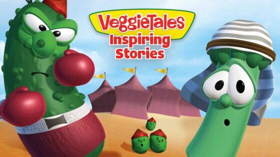 Cartoon VeggieTales cover with two characters in boxing poses, a green cucumber fighter on the left and a tall bean on the right wearing a striped hat; desert-style background with tents and small peas in the foreground; title reads 'VeggieTales Inspiring Stories'