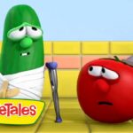 Green cucumber with a white bandage and crutch speaks to a worried red tomato in a bright yellow kitchen, VeggieTales scene.
