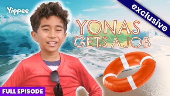 Smiling boy in a red shirt at the beach with an orange lifebuoy and the headline 'YONAS GETS A JOB'.