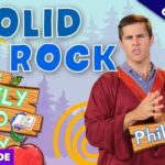Man in a red robe gestures with clasped hands in a bright, cartoon-style forest thumbnail for a daily devotional show, sign reads Phil. 4:6-7