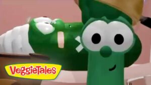 Friendly green VeggieTales character with big round eyes and a smile; VeggieTales logo in the bottom-left corner.