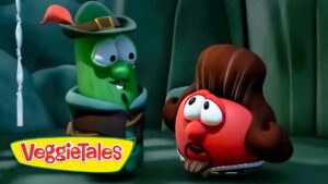 Green cucumber wearing a hat talks to a red rounded veggie in a cave; VeggieTales logo visible at bottom left.