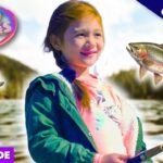 Smiling girl by a lake holding a fishing rod, with colorful Dad Ventures logo and fish graphics in the frame (video thumbnail).