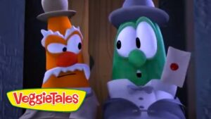 Two VeggieTales characters in formal attire—orange one with a top hat and white mustache and a green cucumber-like character in a bow tie—stand side by side, looking surprised, with a VeggieTales logo in the corner.