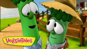 Two animated green vegetable characters from VeggieTales wearing straw hats on a sunny farm, smiling at each other with the VeggieTales logo in the corner.