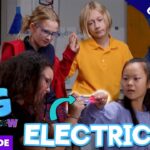 Adult presenter demonstrates a glowing electrical device to a group of diverse children in a classroom; thumbnail for an electricity episode of a science show.