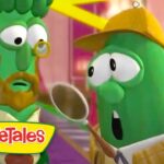 Two green VeggieTales characters in a bright setting, one with a monocle and beard and the other wearing a yellow hat and scarf, holding a ladle; VeggieTales logo visible.