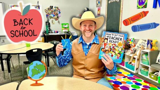 Man in a cowboy hat and vest sits in a colorful classroom, holding a 'How To Get Your Teacher Ready' book and a blue cup. (Back to School theme)