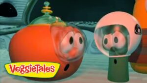 Two cartoon vegetables wearing diving helmets underwater, facing each other near a yellow VeggieTales logo in the corner.