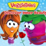 VeggieTales cover featuring colorful veggie characters—tomato chef, a girl veggie, a pink veggie with a rose, asparagus in a suit, and a green car—against a snowy blue background with ‘VeggieTales Discover Inner Beauty’ text.