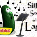 Larry the cucumber from VeggieTales sings into a microphone with musical notes around him; title 'Silly Songs with Larry' and VeggieTales logo nearby.