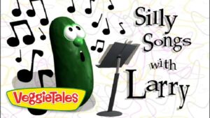 Larry the cucumber from VeggieTales sings into a microphone with musical notes around him; title 'Silly Songs with Larry' and VeggieTales logo nearby.