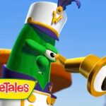 Green veggie chef character blowing a brass horn with a VeggieTales logo in the bottom-left corner, set against a blue sky.