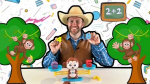 Cheerful teacher in a cowboy hat shows number blocks (4 and 8) for a kids' math lesson, with playful monkeys and a chalkboard reading 2+2 in the background.