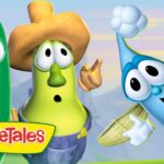 Three VeggieTales characters—a green cucumber, a yellow corn wearing a hat, and a blue veggie—pose together with the VeggieTales logo visible.