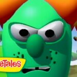Angry green VeggieTales character with a big nose and orange pigtails, logo in the corner.