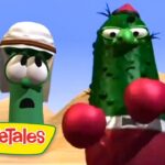 Larry the Cucumber and another green VeggieTales character wearing red boxing gloves boxer in a desert scene, with the VeggieTales logo in the corner.