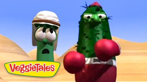 Larry the Cucumber and another green VeggieTales character wearing red boxing gloves boxer in a desert scene, with the VeggieTales logo in the corner.